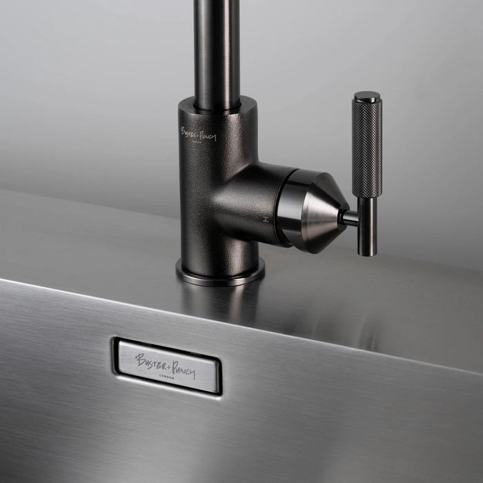 Close-up of Buster + Punch gun metal kitchen faucet handle and knurled detailing