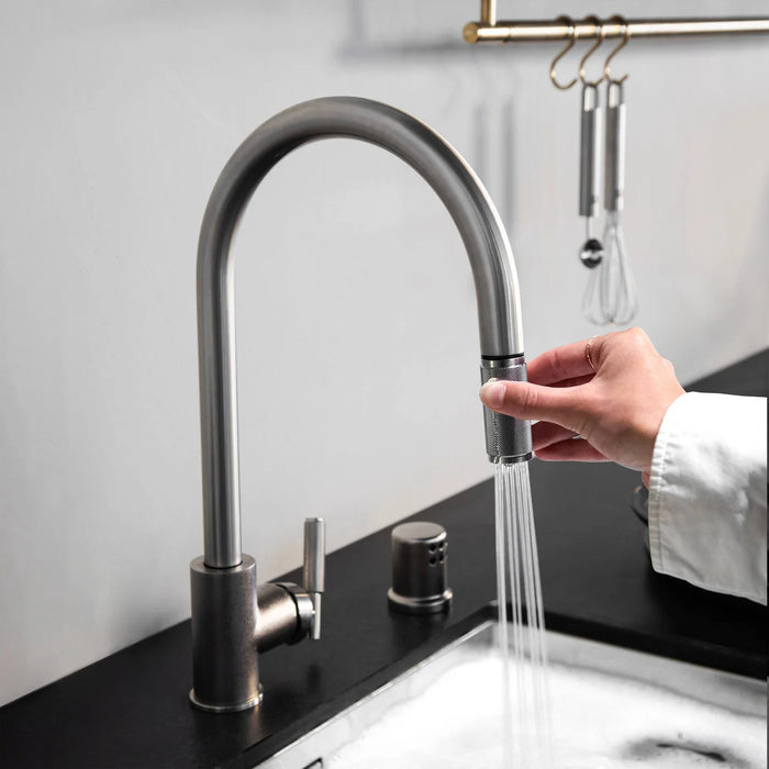 Dual spray function on Buster + Punch gun metal kitchen faucet