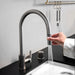 Dual spray function on Buster + Punch gun metal kitchen faucet
