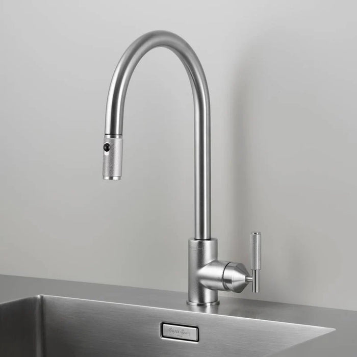 Angled view of Buster + Punch steel kitchen faucet