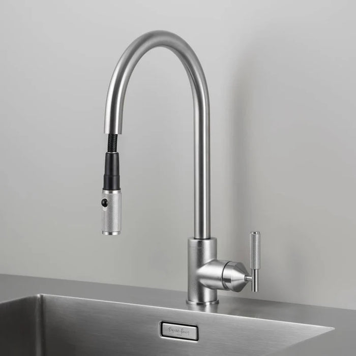 Close-up of Buster + Punch steel kitchen faucet with pull-out spray