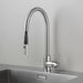 Close-up of Buster + Punch steel kitchen faucet with pull-out spray