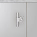 Front view of Buster + Punch T-Bar CAST cabinet knob in steel finish mounted on cabinet door