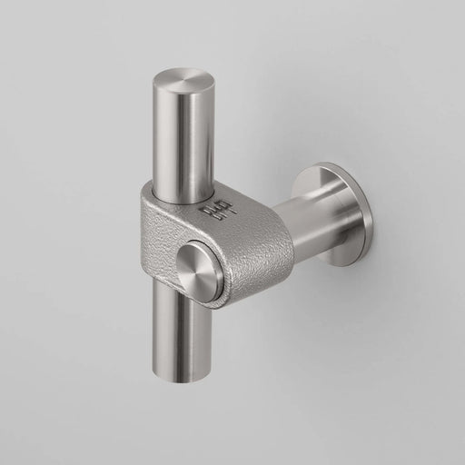Buster + Punch T-Bar CAST cabinet knob in steel finish with rough cast texture mounted on cabinetry