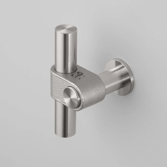 Buster + Punch T-Bar CAST cabinet knob in steel finish with rough cast texture mounted on cabinetry