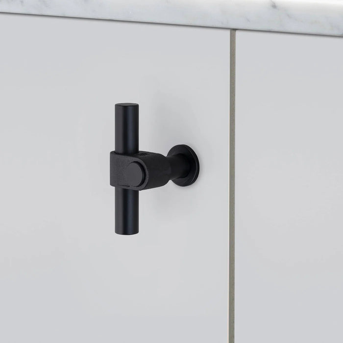 Angled side view of Buster + Punch T-Bar CAST cabinet knob in Welders Black finish