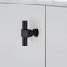 Angled side view of Buster + Punch T-Bar CAST cabinet knob in Welders Black finish