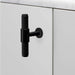 Side view of Buster + Punch T-Bar Cross cabinet knob in Black finish