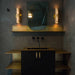 Brass Buster + Punch T-Bar Cross knobs styled in modern bathroom cabinetry