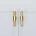 Pair of Buster + Punch T-Bar Cross cabinet knobs in Brass finish