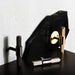 Buster + Punch T-Bar Cross cabinet knobs displayed in Brass, Smoked Bronze , and Steel finishes