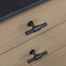 Smoked Bronze Buster + Punch T-Bar Cross knobs installed on wood drawers