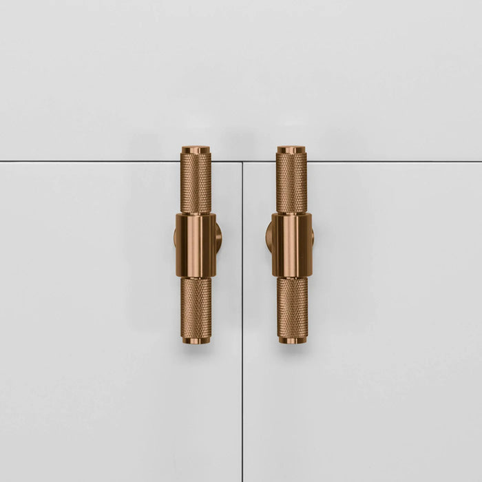 Pair of Buster + Punch T-Bar Cross cabinet knobs in Warm Sunset finish