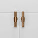 Pair of Buster + Punch T-Bar Cross cabinet knobs in Warm Sunset finish