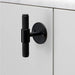 Buster + Punch T-Bar PLATE Cross cabinet knob in black finish mounted on cabinetry