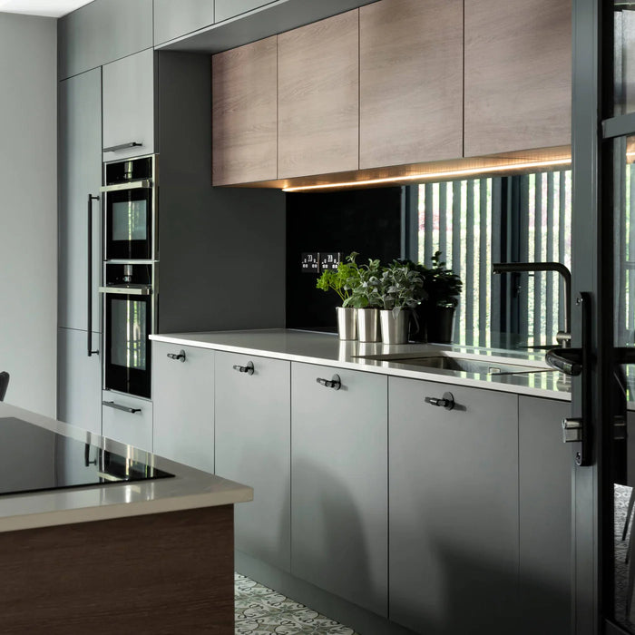 Buster + Punch T-Bar PLATE Cross hardware styled in a contemporary kitchen interior