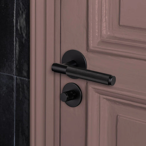 Buster + Punch Cross thumbturn lock in black finish installed on interior door