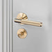 Buster + Punch brass cross thumbturn lock paired with matching door handle