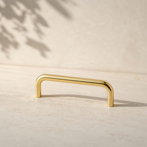 CBH 220 cabinet bar pull in bright brass finish on neutral background minimal product shot