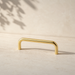 CBH 220 cabinet bar pull in bright brass finish on neutral background minimal product shot