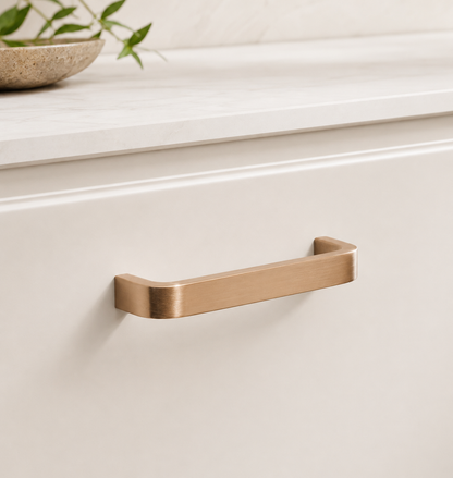 CBH 245 Square Return Bar cabinet pull in satin bronze finish installed on cream cabinetry
