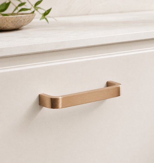 CBH 245 Square Return Bar cabinet pull in satin bronze finish installed on cream cabinetry