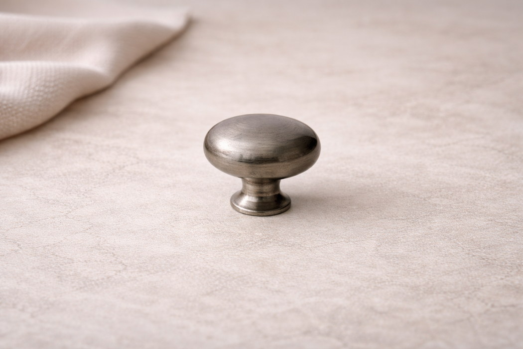 CBH 502 Classic Dome Cabinet Knob in Antique Finish displayed in a lifestyle setting