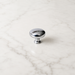 CBH 502 Classic Dome Cabinet Knob in bright chrome with rounded dome design on a white marble surface.