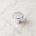 CBH 503 Minimalist Round Cabinet Knob in Bright Chrome finish displayed on marble