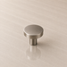CBH 503 Minimalist Round Cabinet Knob in Pewter finish displayed on stone surface