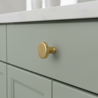 CBH 503 Minimalist Round Cabinet Knob in Satin Brass finish installed on painted cabinetry