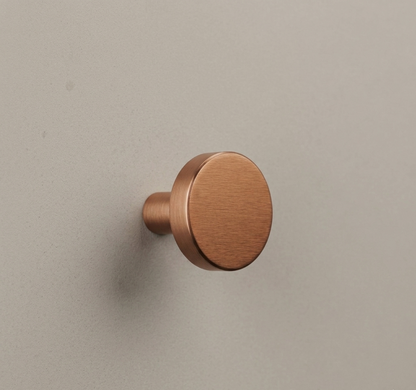 CBH 503 Minimalist Round Cabinet Knob in Satin Bronze finish installed on cabinetry