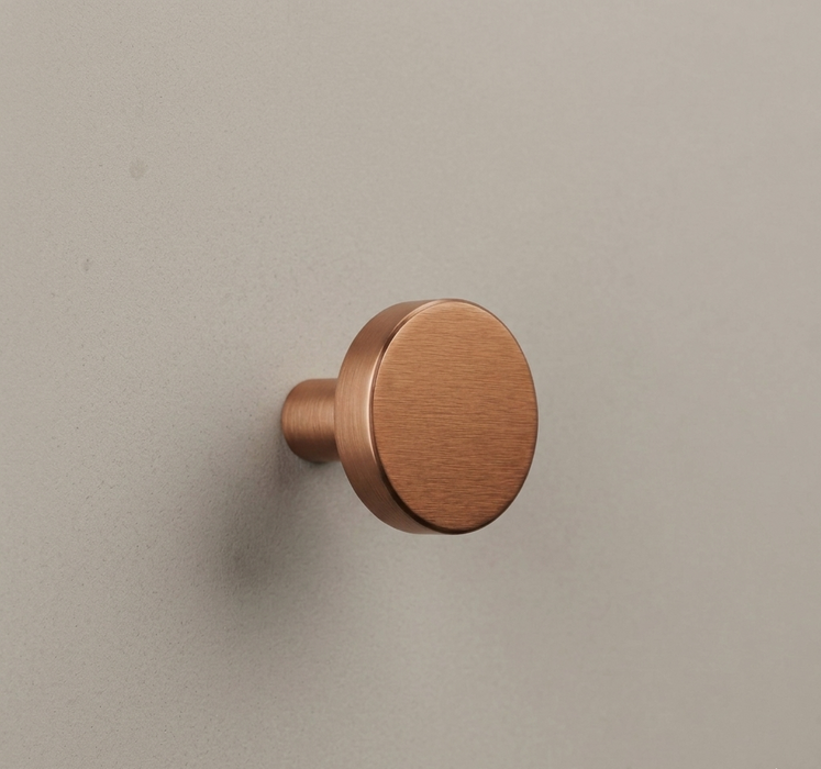 CBH 503 Minimalist Round Cabinet Knob in Satin Bronze finish installed on cabinetry