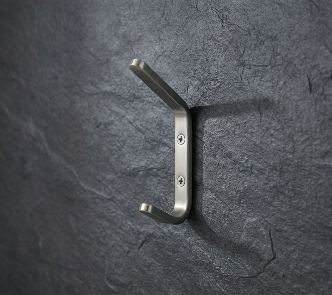 CBH 61 rounded minimalist coat hook installed on textured dark wall modern wall hook design