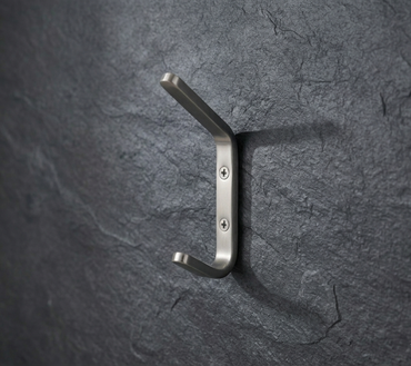 CBH 61 rounded minimalist coat hook installed on textured dark wall modern wall hook design