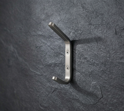 CBH 61 rounded minimalist coat hook installed on textured dark wall modern wall hook design