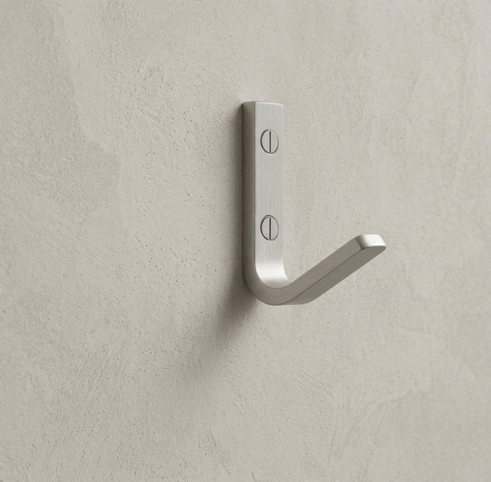 CBH 62 wall hook in satin chrome finish installed on textured beige wall minimal modern hook