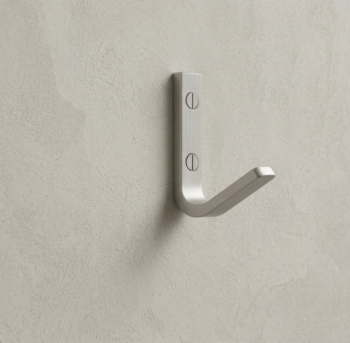 CBH 62 wall hook in satin chrome finish installed on textured beige wall minimal modern hook
