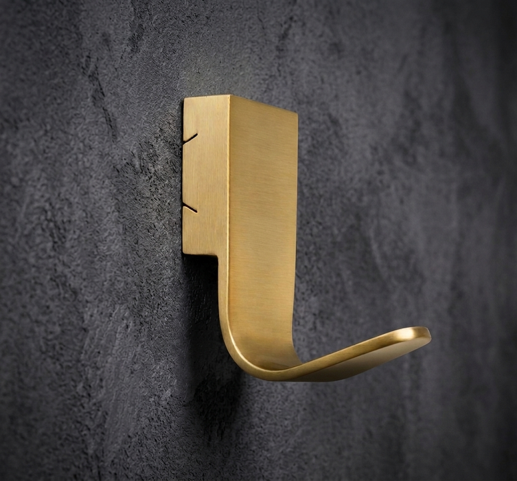 CBH 68 angled projection coat hook in satin brass finish installed on dark textured wall