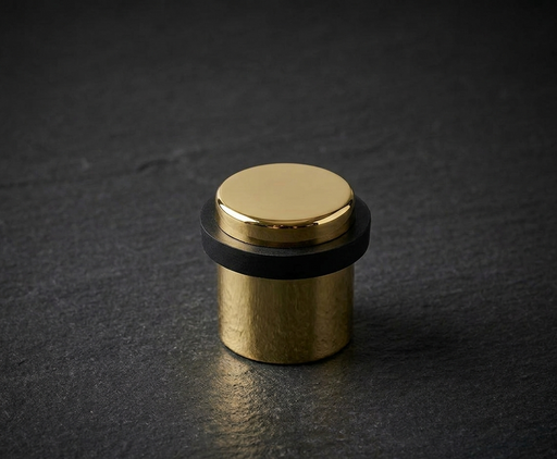 CBH 87 cylindrical floor door stop in bright brass finish 
