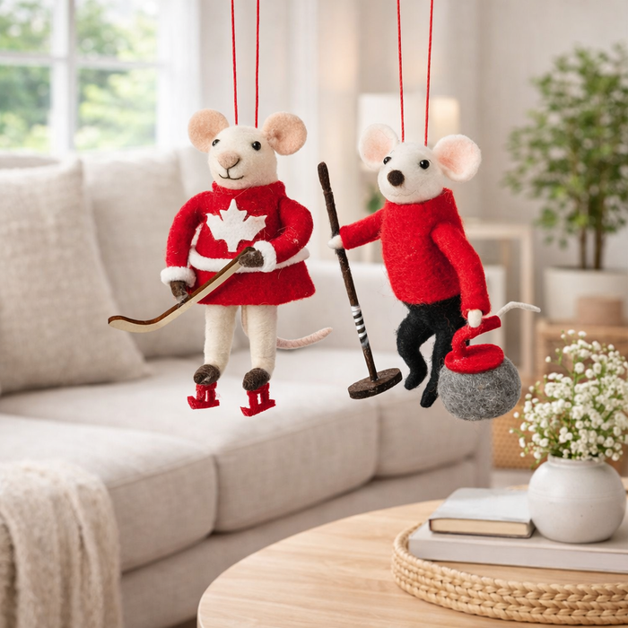 Curling and hockey mouse ornament set displayed together home decor
