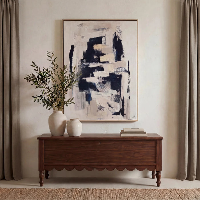 Everren Pietro black and beige abstract canvas displayed above a wooden console