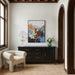 Everren Poise abstract canvas wall art displayed above a cabinet in a modern interior