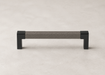 Close-up of the Häfele Elite Leather cabinet handle in black installed on modern cabinetry.