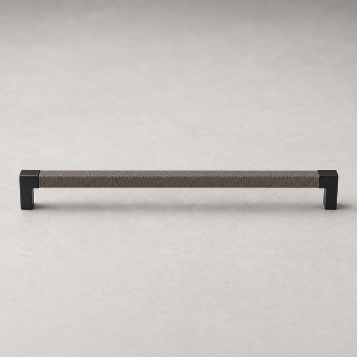 Häfele Elite Leather cabinet handle in matte black finish with Pewter faux leather insert, front view.