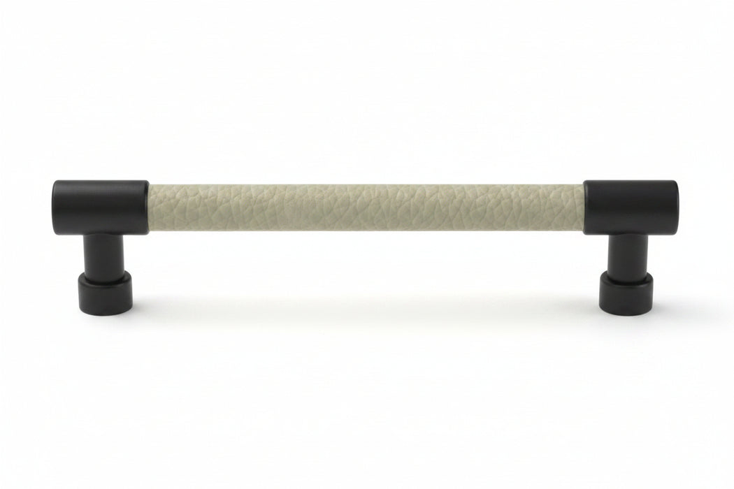 Häfele Elite Leather cabinet pull in Matte Black and Oyster faux leather, 152 mm overall length with 128 mm centre-to-centre.