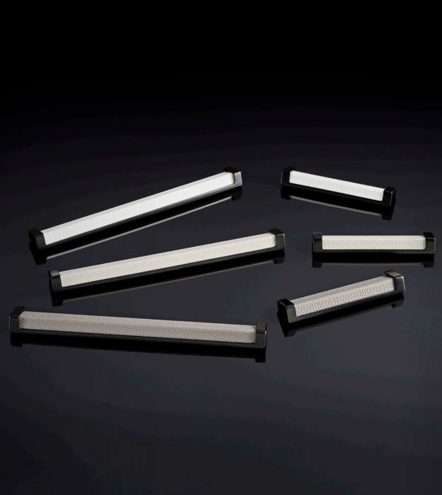Häfele Elite Leather recessed cabinet handle collection in matte black with Winter, Oyster, and Pewter faux leather inserts.