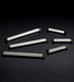 Häfele Elite Leather recessed cabinet handle collection in matte black with Winter, Oyster, and Pewter faux leather inserts.