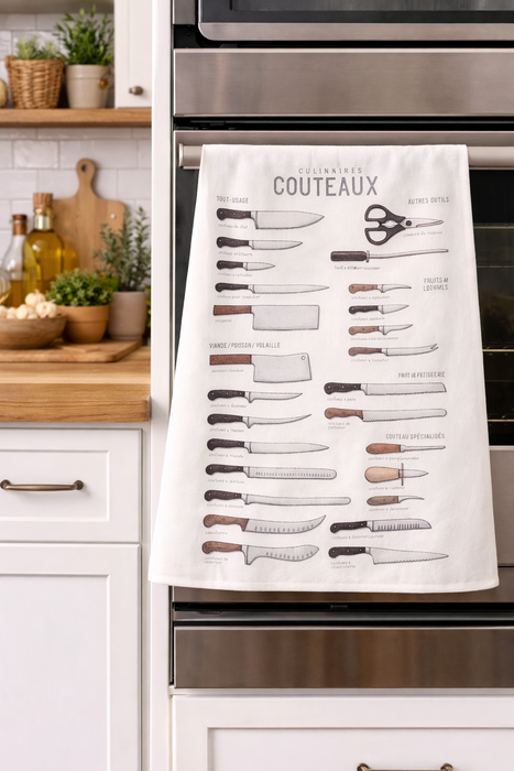 Knife illustration kitchen towel hanging on oven in modern kitchen setting