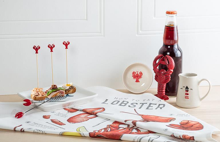 Lobster kitchen towel styled in modern kitchen setting with seafood elements